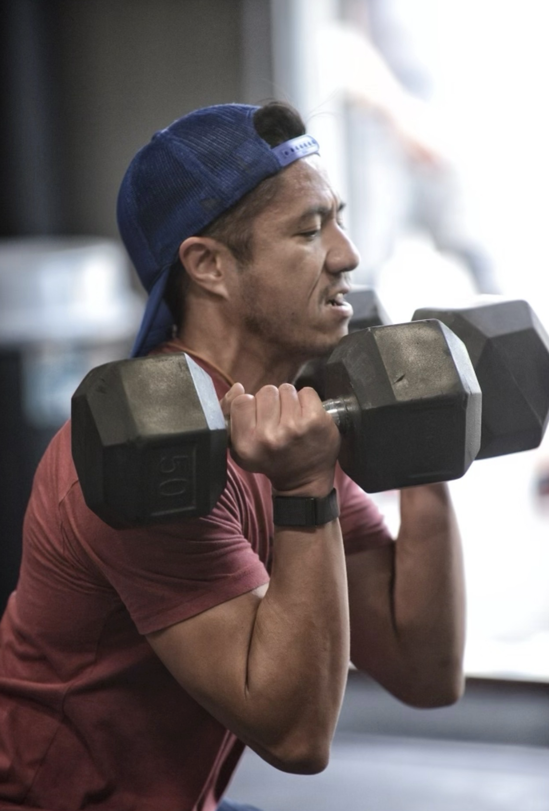 Athlete training with dumbbells
